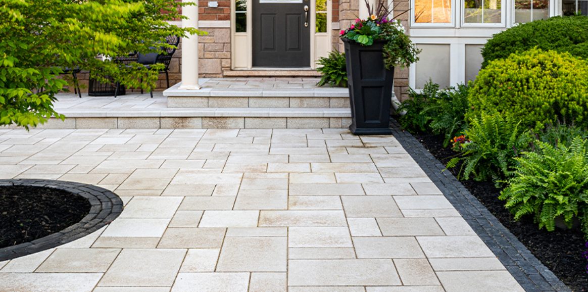 Unilock paver walkway and steps leading to a front entry