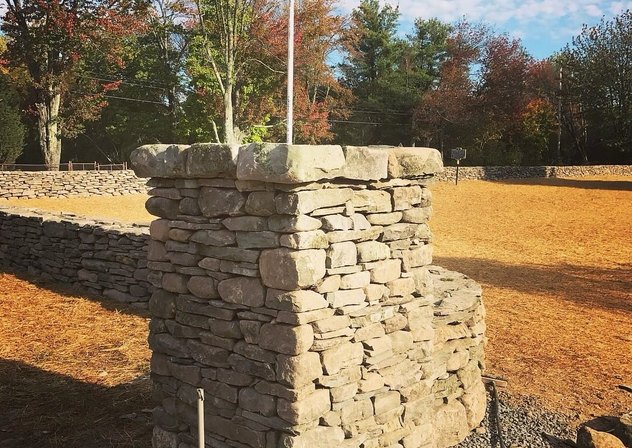 Dry-laid fieldstone pillar and stone walls
