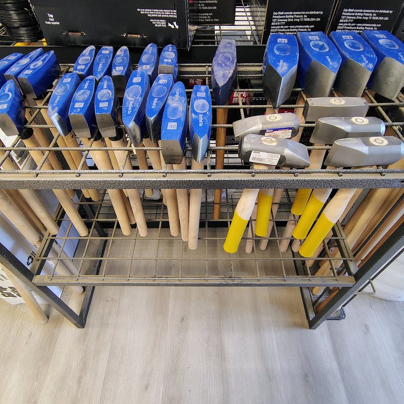 Rack of sledge hammers and stone hammers