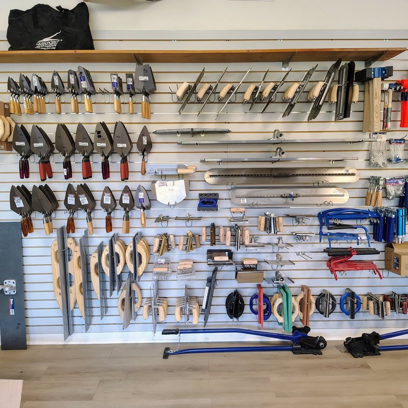 Wall of masonry and concrete trowels, floats, edgers and groovers