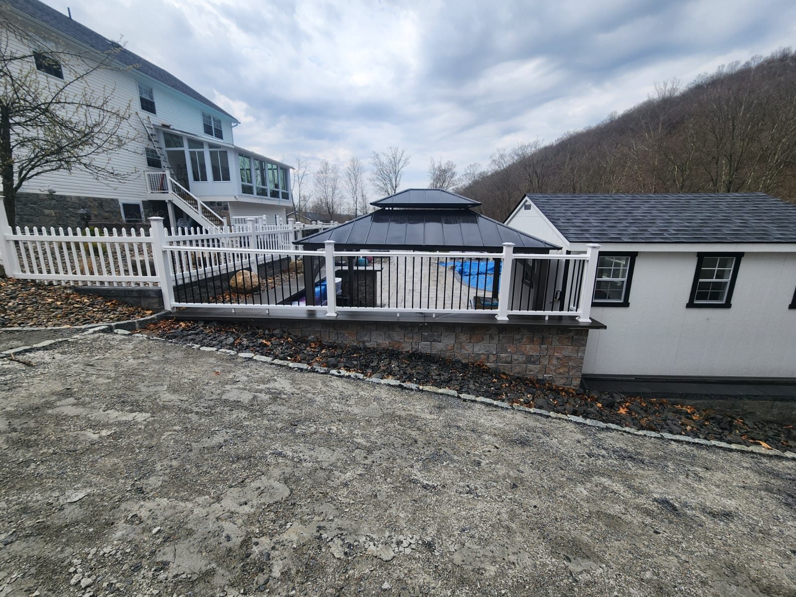 Retaining wall supporting a deck and gazebo area