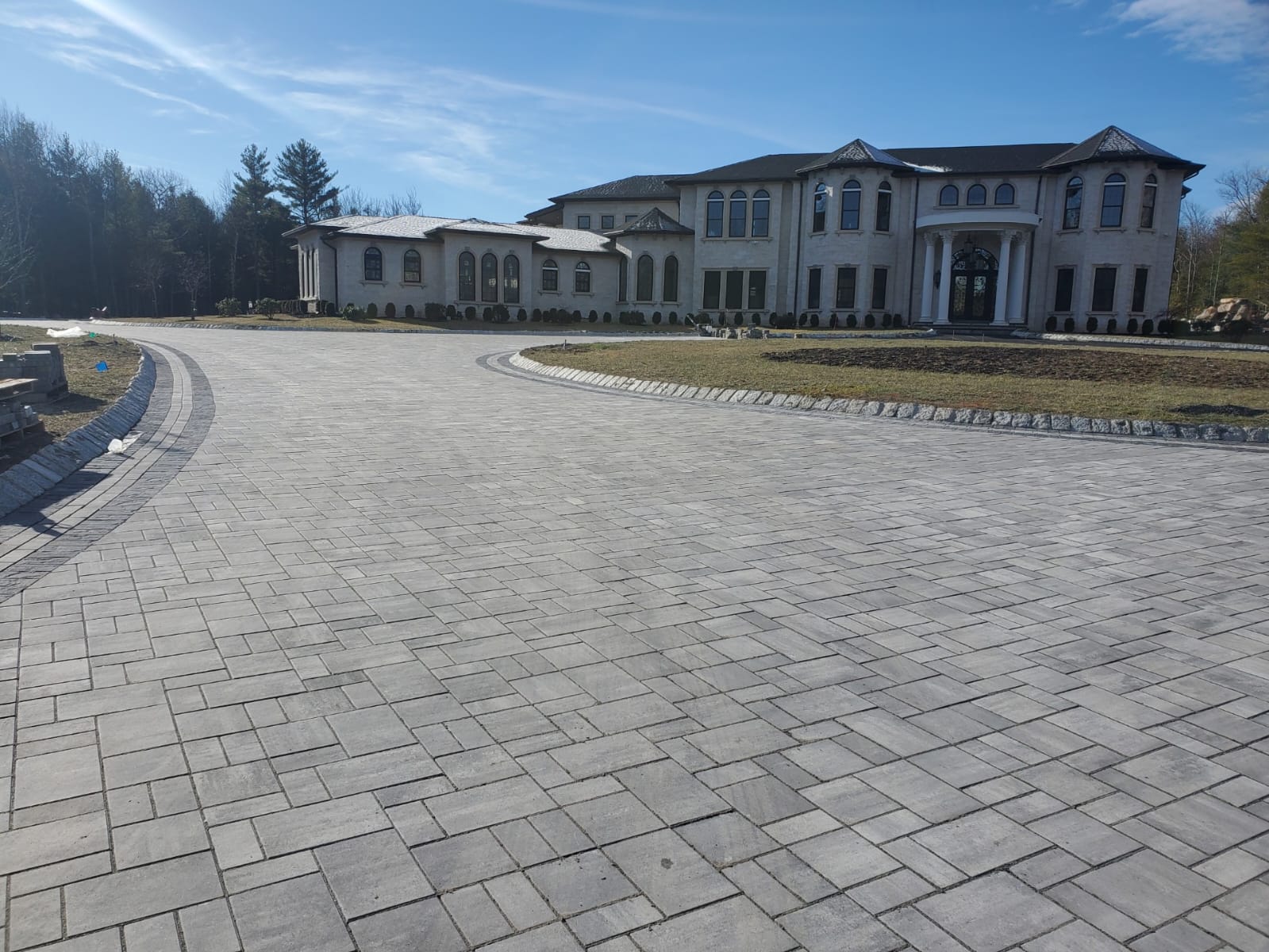 Paver patio with outdoor kitchen and bar seating