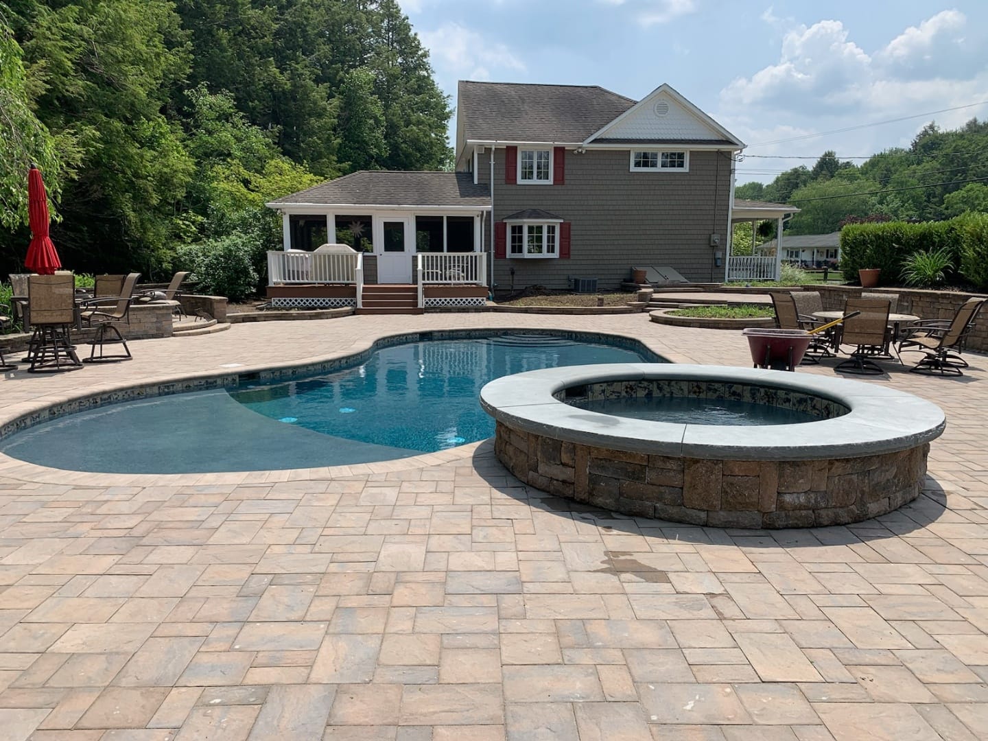 Paver pool patio with built-in spa