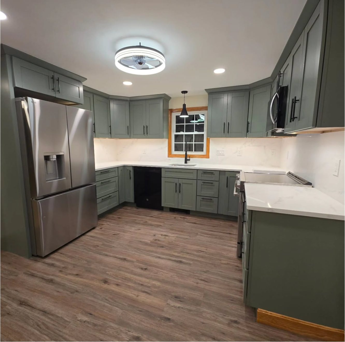 Kitchen remodel with matching porcelain-look countertops and backsplash