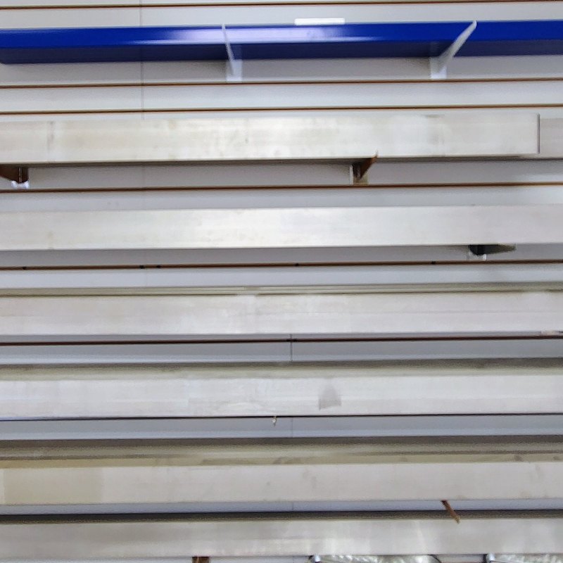 Aluminum screed boards on a slatwall rack