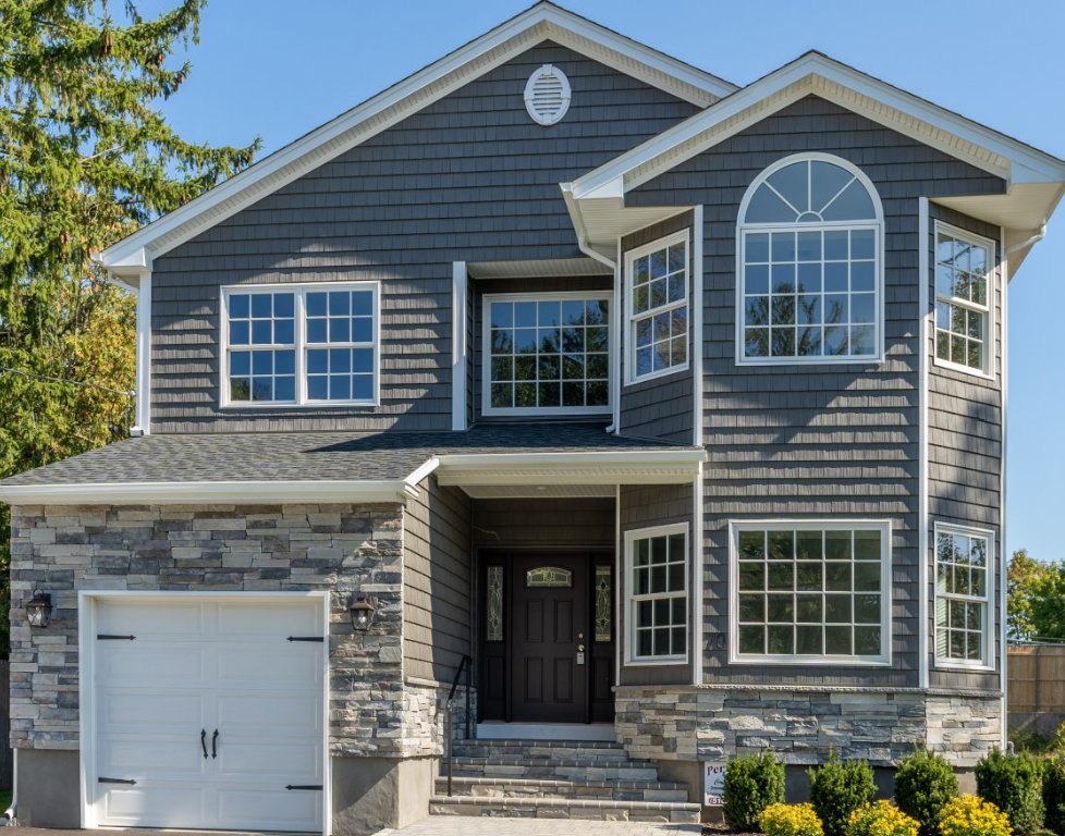 Home with Cultured Stone ledgestone garage front and foundation