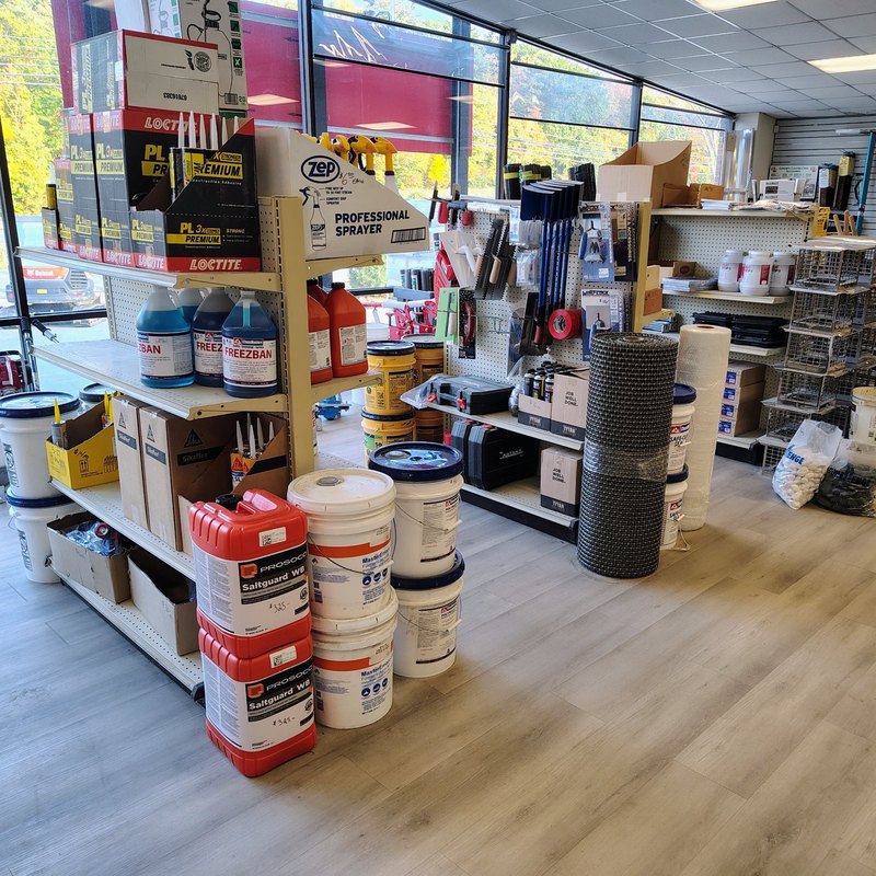Showroom aisles with sealers, adhesives and concrete tools