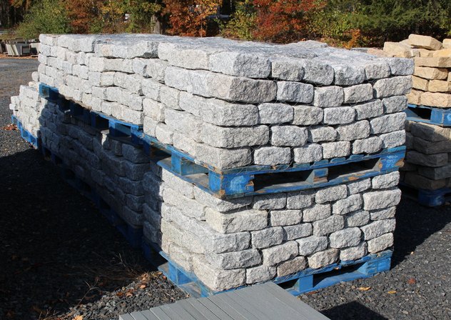 Pallets of granite wall stone at the yard