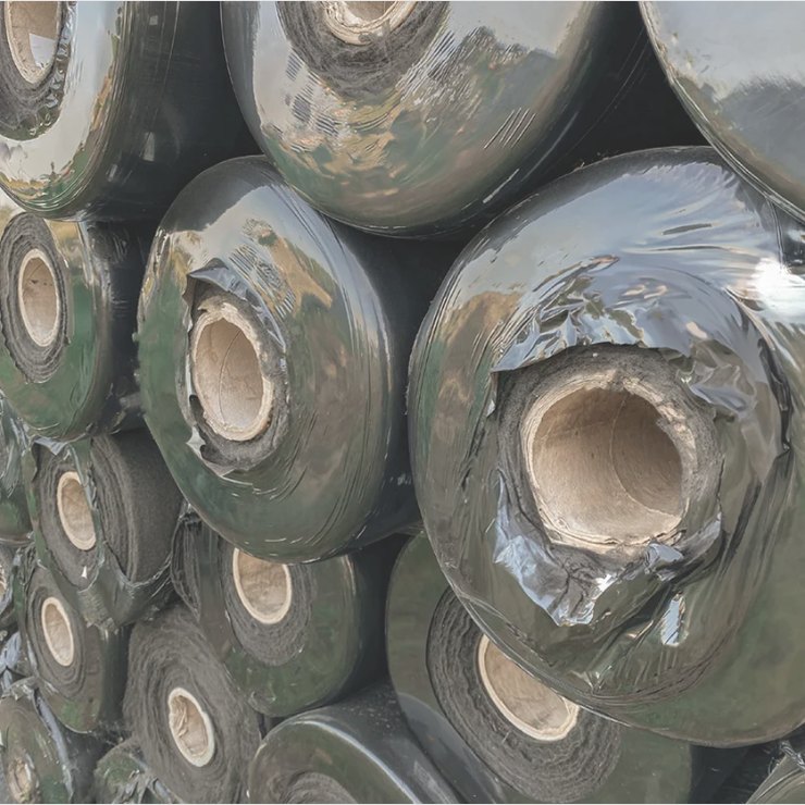 Rolls of nonwoven fabric stacked in the yard
